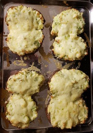 A picture of Cheese and broccoli baked potatoes.