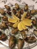 Stuffed Calamari with Black Olive Tapenade, Tomato Confit, and Garlic