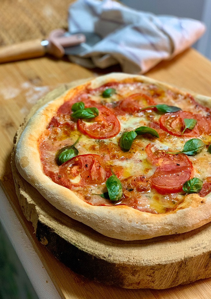 Una foto de Pizza con masa madre