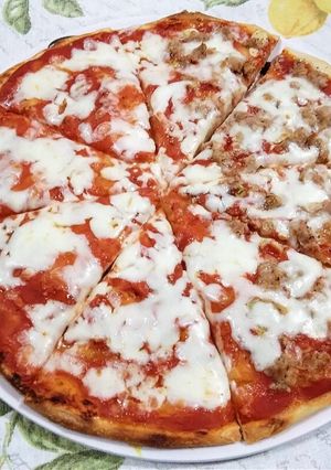 A picture of Pizza with Sourdough Starter: Half Margherita and Half with Tuna.