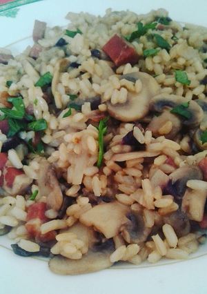 Foto di Risotto integrale con funghi speck e radicchio