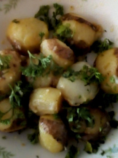 Una foto de Papitas con Mantequilla y Perejil