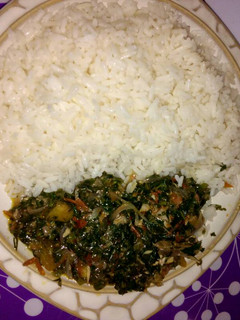 A picture of White rice with vegetable sauce.