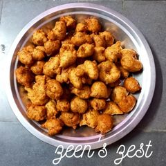 A picture of Two Lentil Fritters or Moong Maash ke Bhajiye.
