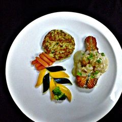 A picture of Salmon And Shrimp with Rostie Potato.