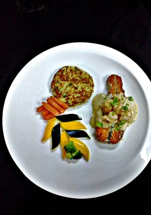 A picture of Salmon And Shrimp with Rostie Potato.