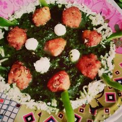 A picture of Paneer kofta in Palak gravy.