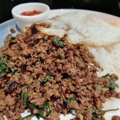 A picture of My version of Thai Basil Beef (Pad Ka Prao) with dried chillies, topped with fried eggs.