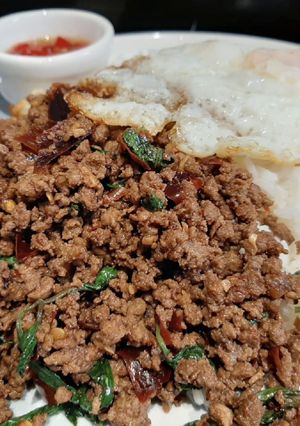A picture of My version of Thai Basil Beef (Pad Ka Prao) with dried chillies, topped with fried eggs.
