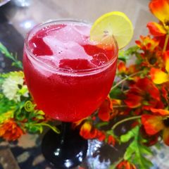 A picture of Traditional lal sharbat with lemon.