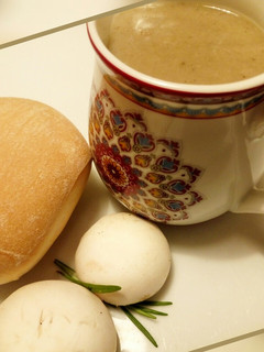 A picture of Bread and mushroom sauce.