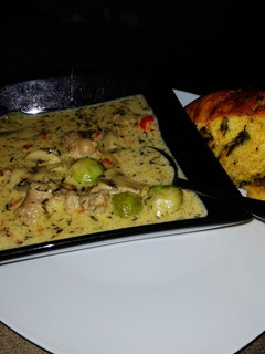 A picture of Mushroom and sausage soup.