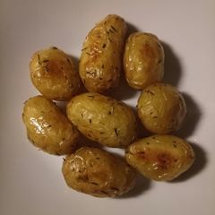 A picture of Roasted potatoes with olive oil and herbs.