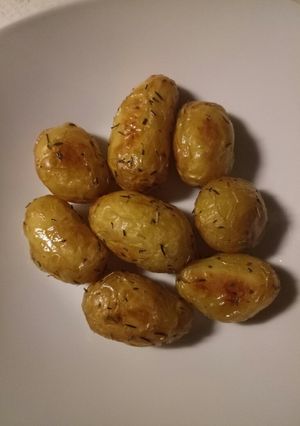 A picture of Roasted potatoes with olive oil and herbs.