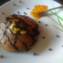 A picture of Choco pancake topped with caramelized banana.