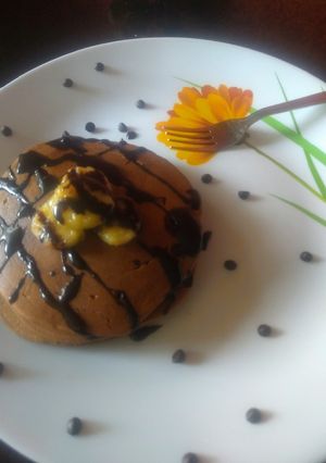 A picture of Choco pancake topped with caramelized banana.