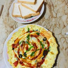 A picture of Pizza omellete with toast.