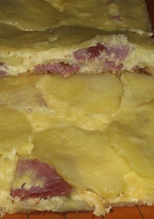 Una foto de Pastel de papas, panceta/bacón y queso