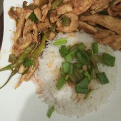 A picture of Thai dry chicken chilli with garlic rice.