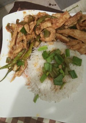 A picture of Thai dry chicken chilli with garlic rice.