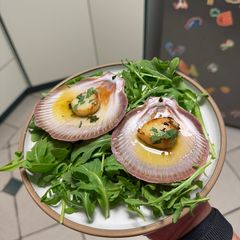 A picture of Pan Seared Scallops in a Garlic Herb Reduction.