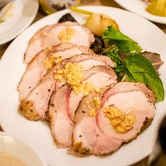 A picture of Roast pork with apple sauce.