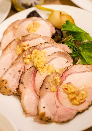 A picture of Roast pork with apple sauce.