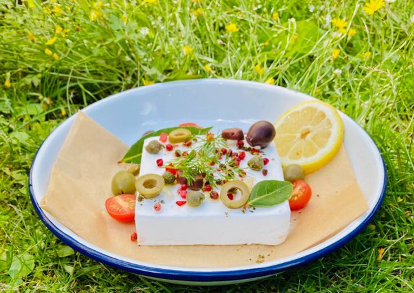 Baked Vegan Feta with olives, pink peppercorns, lemon and summer herbs and veggies ðŸŒ±