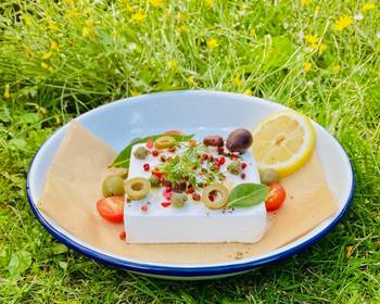 Unique Cuisine Baked Vegan Feta with olives pink peppercorns lemon and summer herbs and veggies  Practical Delicious