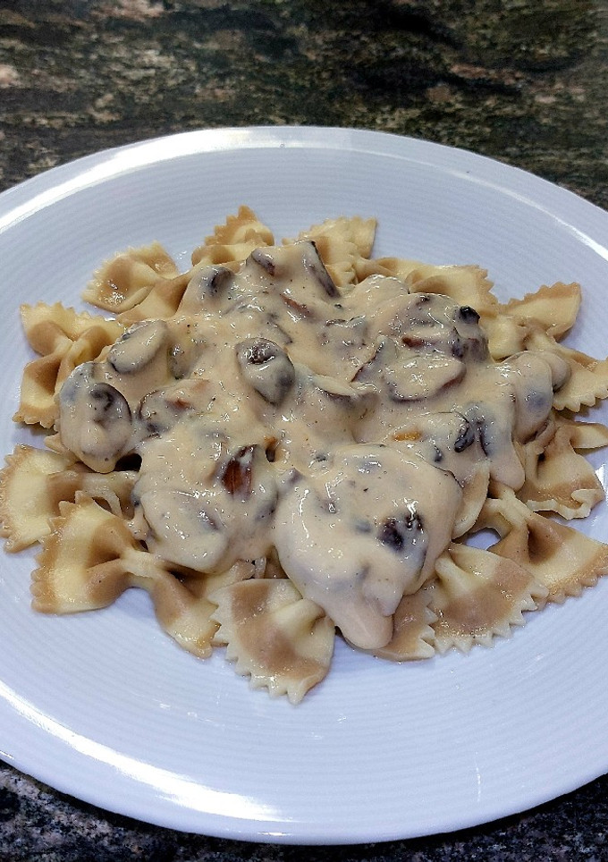 Una foto de Farfalle de boletus con salsa de parmesano y champiñones