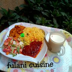 A picture of Tumeric rice with vegetables.
