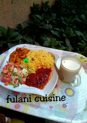 A picture of Tumeric rice with vegetables.