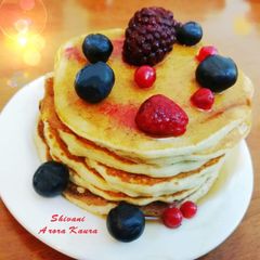 A picture of Oats Pancakes with Honey and Berries (Eggless).
