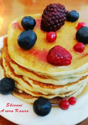A picture of Oats Pancakes with Honey and Berries (Eggless).