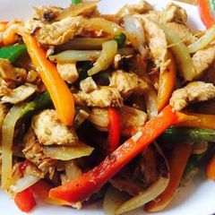 A picture of Satay Chicken and vegetables.