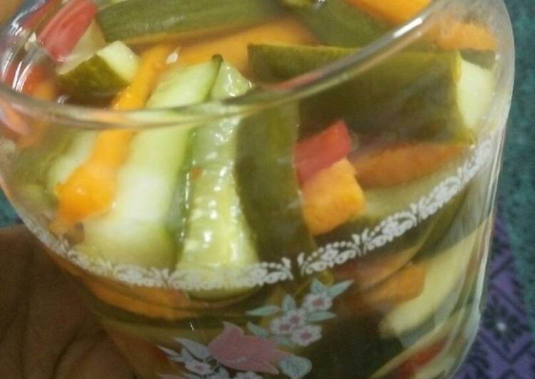Pickled cucumber &amp; carrot accompanied with freshgreen &amp; red chillies