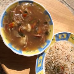 A picture of Vegetable soup with rice.
