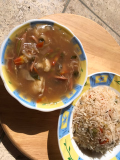 A picture of Vegetable soup with rice.