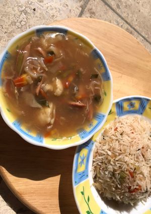A picture of Vegetable soup with rice.