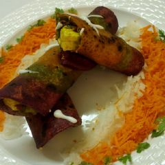 Tricolour paneer roll with salad and mayo A picture of Tricolour paneer roll with salad and mayo.