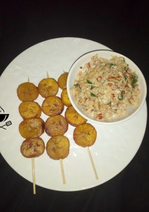 A picture of Scrambled egg with plantain kebab.