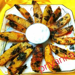 A picture of Spicy coriander potato wedges.