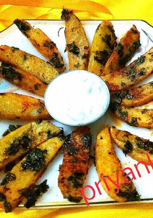 A picture of Spicy coriander potato wedges.