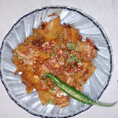 A picture of Raw papaya sabzi🧄🧅🍅🌶️.
