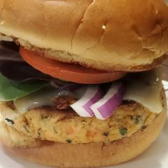 A picture of Brad's spinach and feta salmon burgers with peri-peri sauce.