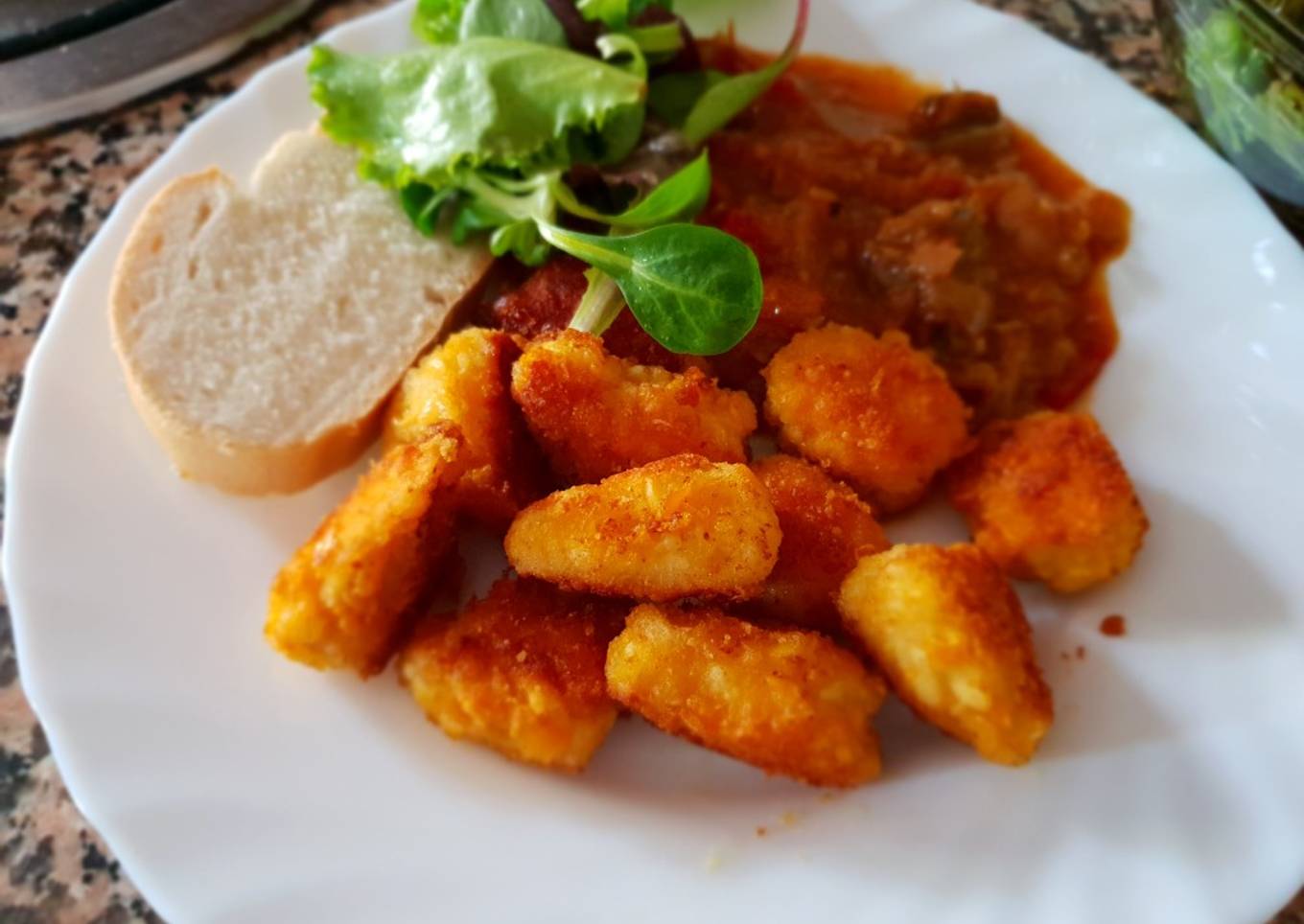Nuggets de pollo con pisto