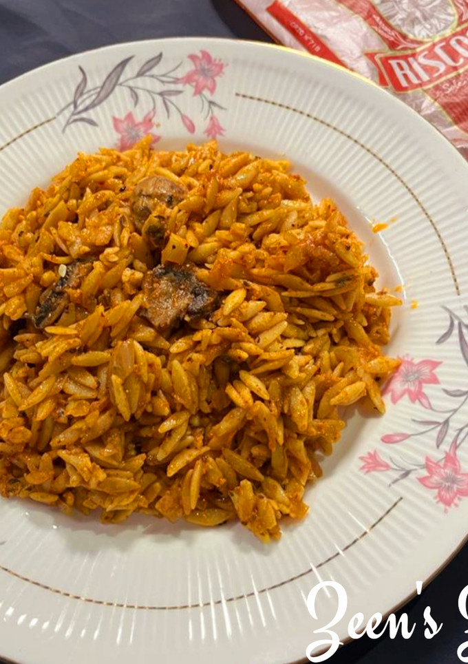 A picture of Orzo with Button Mushrooms in Red Sauce.