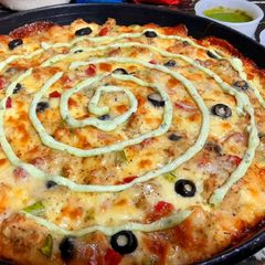 Chicken Malai boti pizza A picture of Chicken Malai boti pizza.
