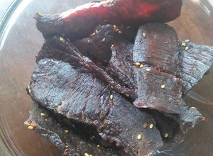 A picture of Momma's Teriyaki Beef Jerky (in a dehydrator).