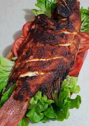 A picture of Jimbaran grilled red snapper fish.